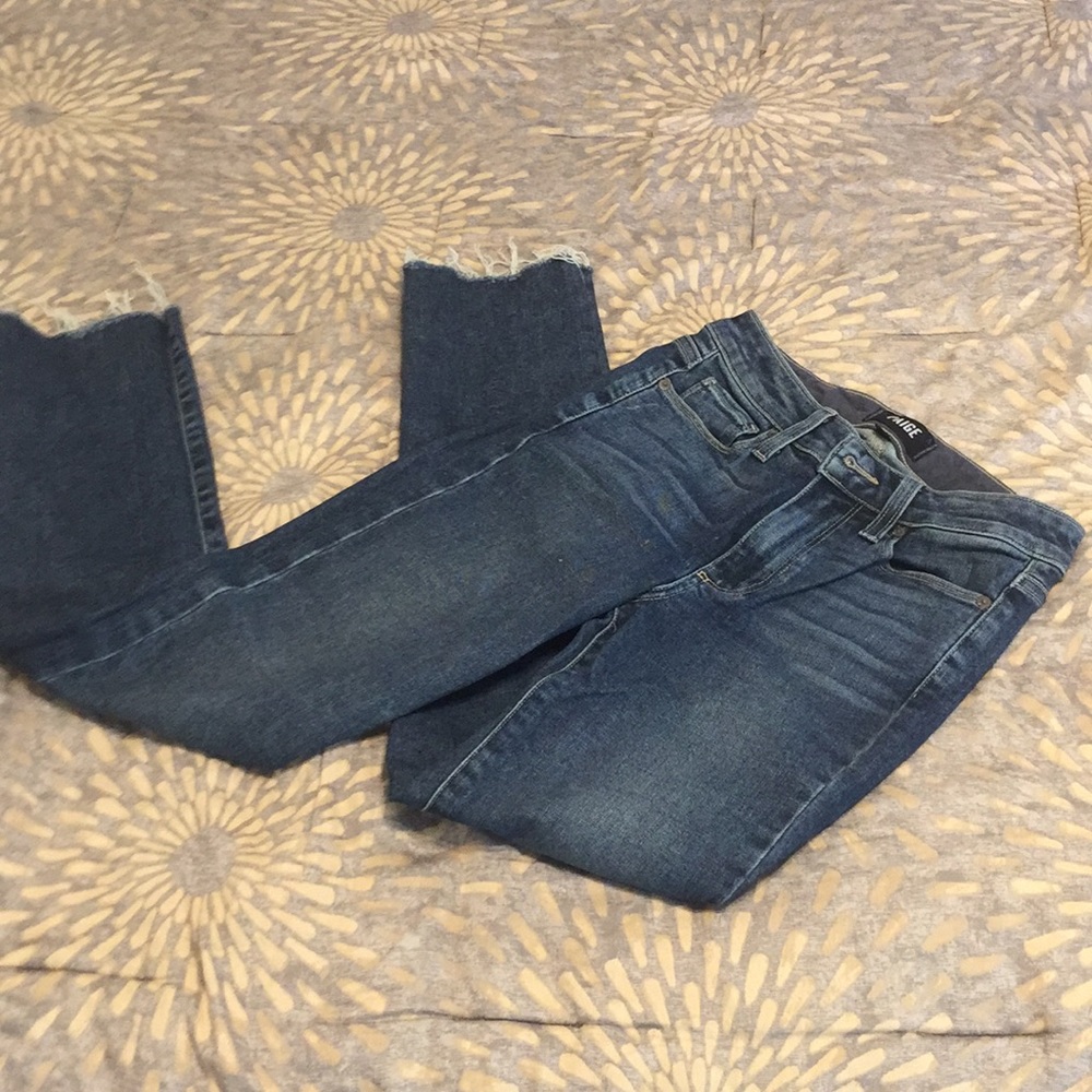 Mid rise, raw hem, strait jean. Dark blue
